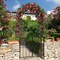 Costway Garden Arch Arbor Trellis with Gate 7.5 ft Patio Archway Pergola for Wedding
